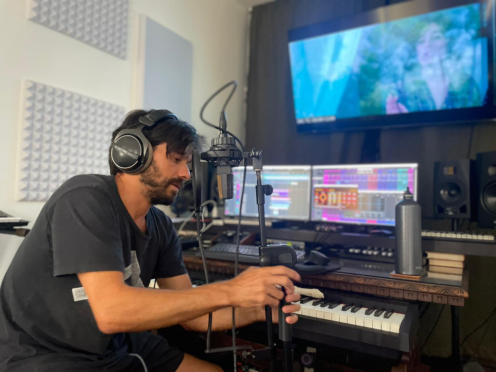 Gal Lev recording at the microphone and keyboard